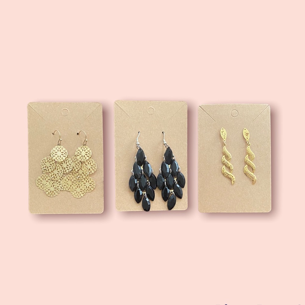 Three pairs of gold tone dangle earrings